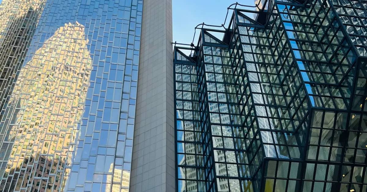 Glass towers and an atrium in Toronto's financial district seen from street level
