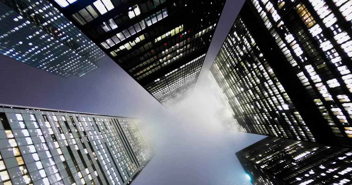 Financial district towers lit up at night — the world a new Canadian MSB is budgeting its way into